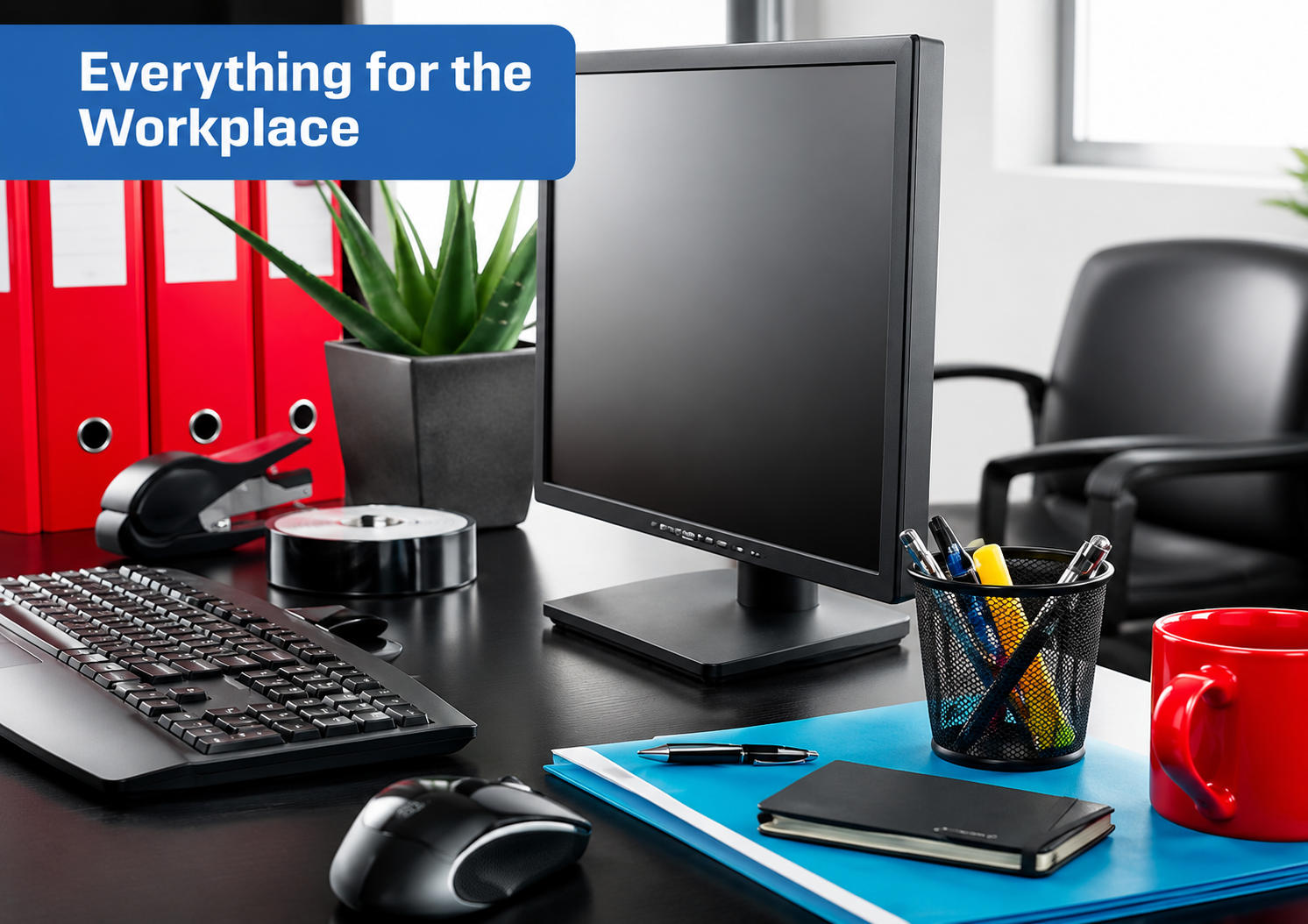 Workplace desk setup with monitor, keyboard, and office accessories